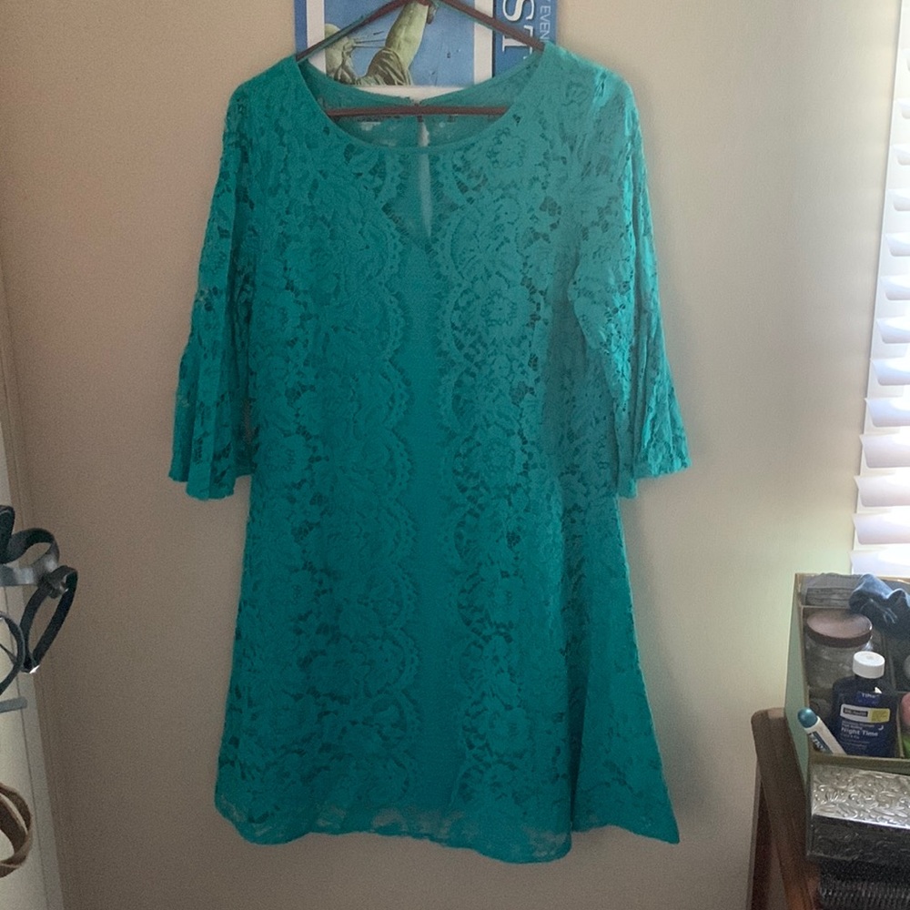 Teal dress, knee length with 1/4 length sleeves. Size: 14 color: teal
